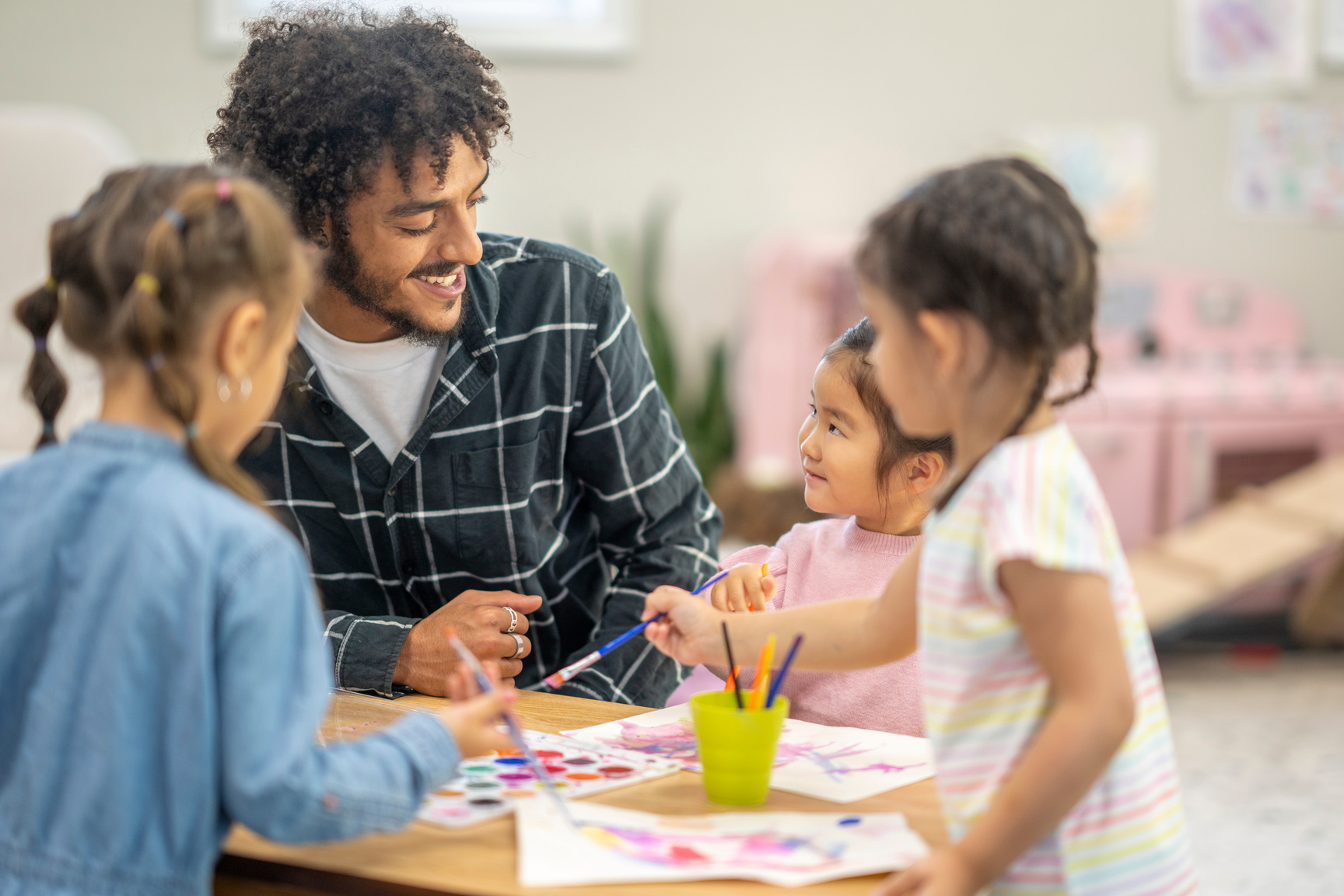 Male Childcare Working Facilitating Painting